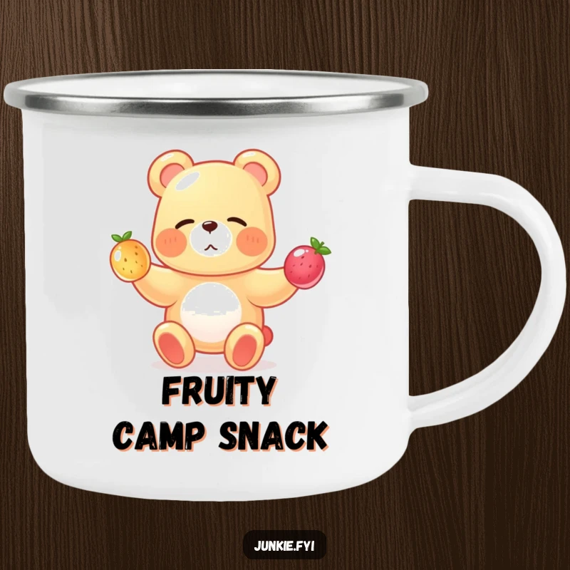 A gummy bear juggles fruits on this fun camping mug, perfect for enjoying drinks outdoors with a smile.